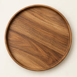 Large 29.5 cm round wooden serving tray centered on a light warm studio background.