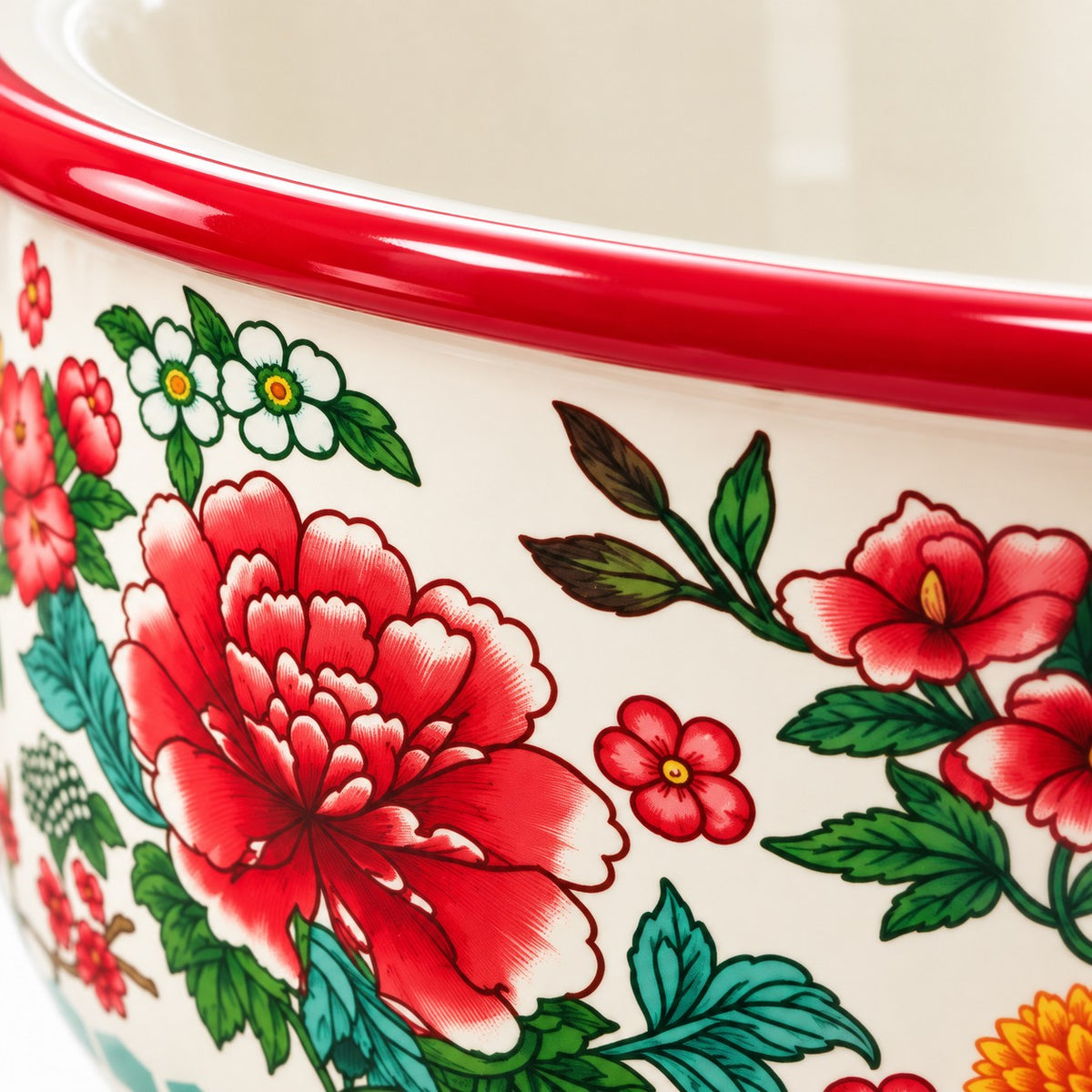 Close-up of the Red Floral enamel kitchen basin showing its glossy rim and smooth floral finish.