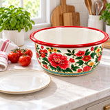 Red Floral enamel kitchen basin beside a dinner plate and tomatoes shows its generous everyday scale.