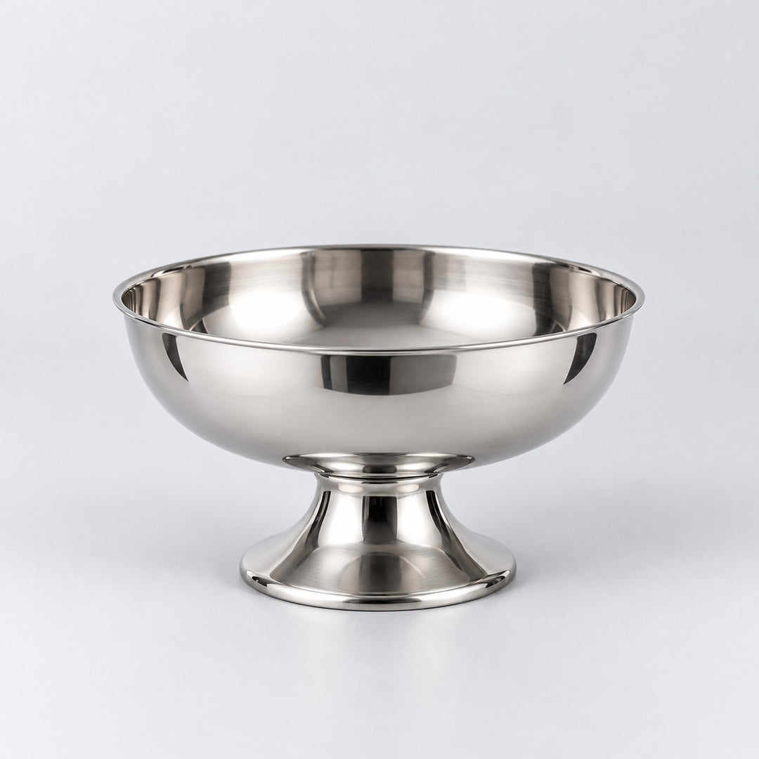 Short pedestal stainless steel dessert cup centered against a light silver studio backdrop.
