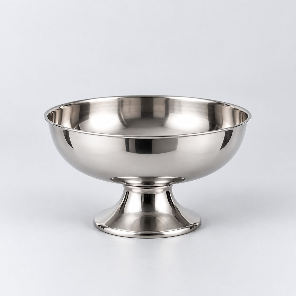 Short pedestal stainless steel dessert cup centered against a light silver studio backdrop.