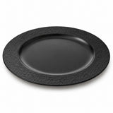 One black melamine serving plate with a wide textured rim and recessed center, shown alone on white.