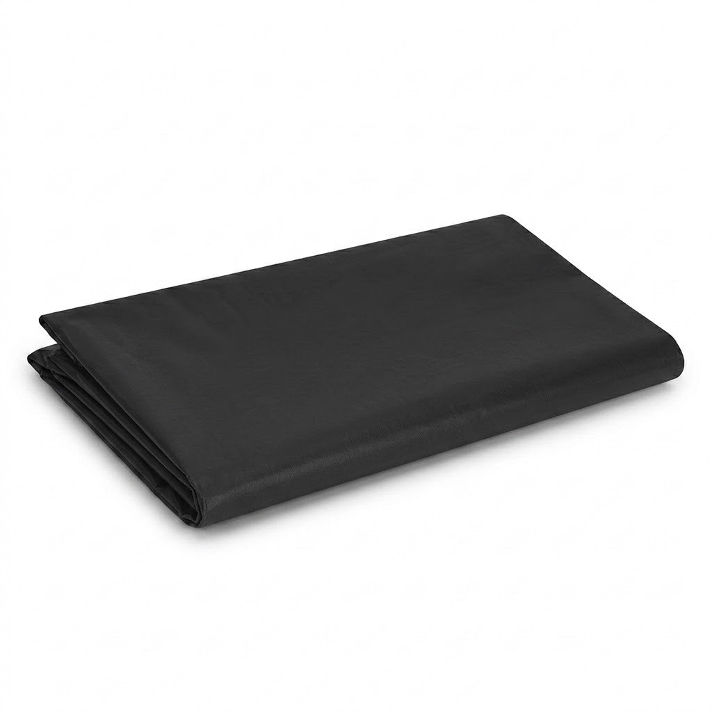 Black perforated baking tray on a white background