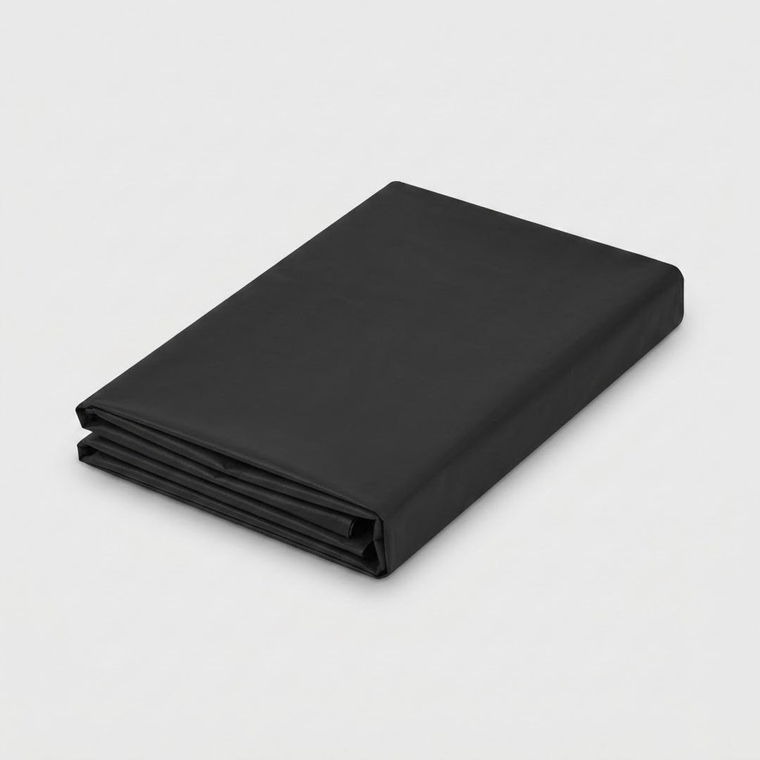 A folded black fabric sheet or blanket with a smooth matte finish, shown on a clean light gray background.