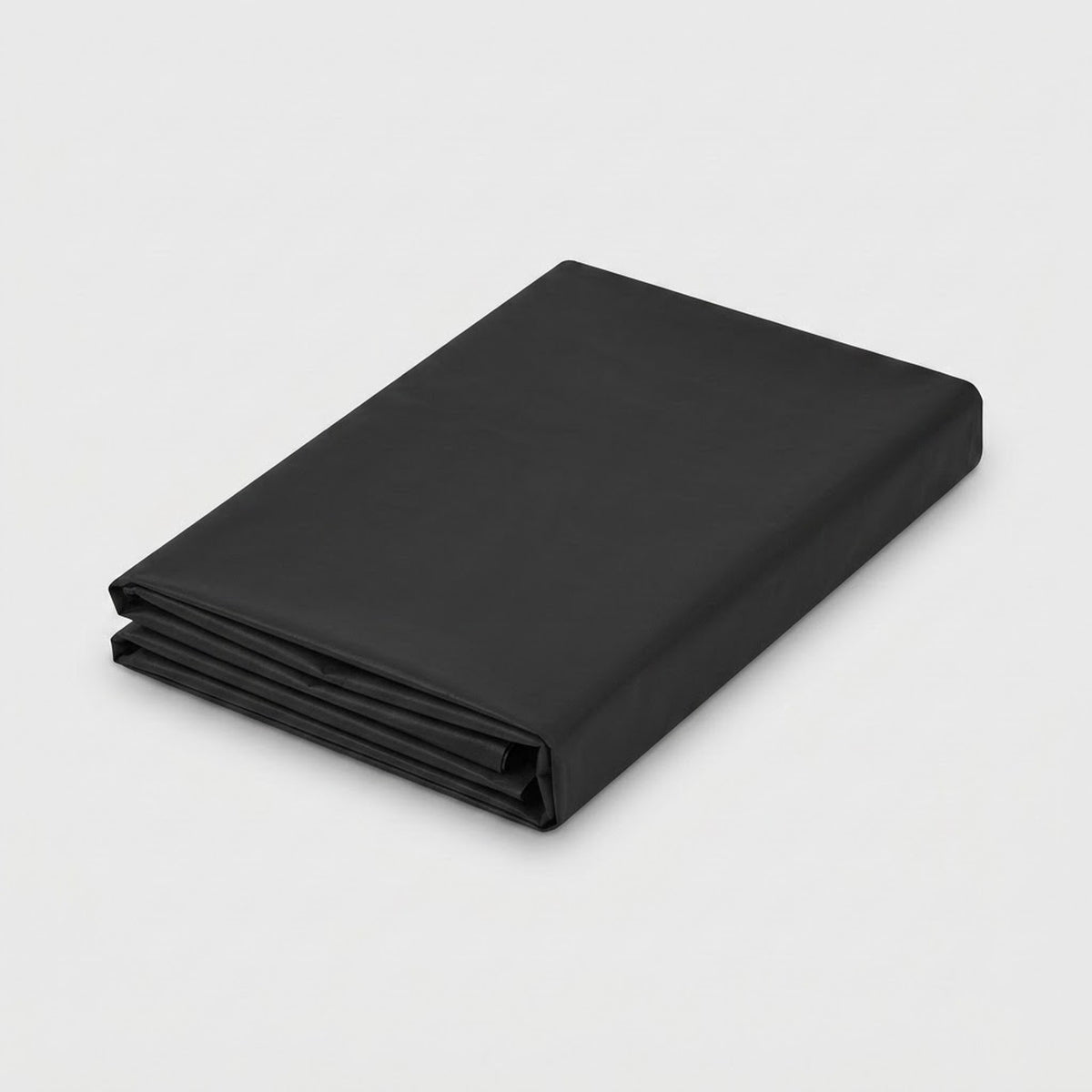 A folded black fabric sheet or blanket with a smooth matte finish, shown on a clean light gray background.