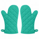 Two matching turquoise cotton blend oven mitts arranged on a pure white background.