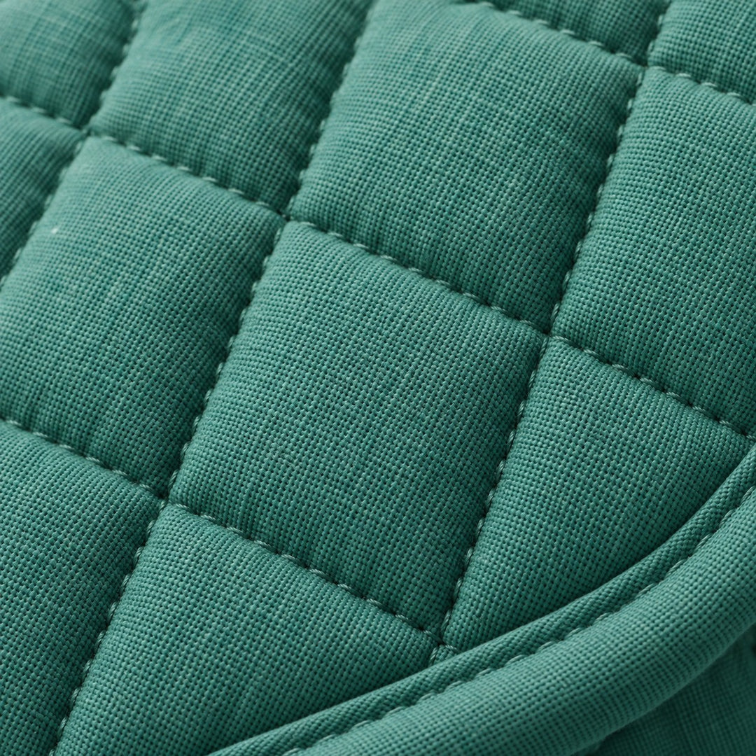 Close-up of the turquoise oven mitt's quilted cotton blend fabric and stitched finish.