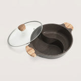A dark gray speckled divided pot with a glass lid featuring light wood handles, displayed on a clean off-white background.