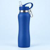 Blue insulated straw bottle centered on a pale blue studio background with its attached carabiner.