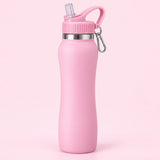 Pink insulated straw bottle centered on a pale pink studio background with its attached carabiner.