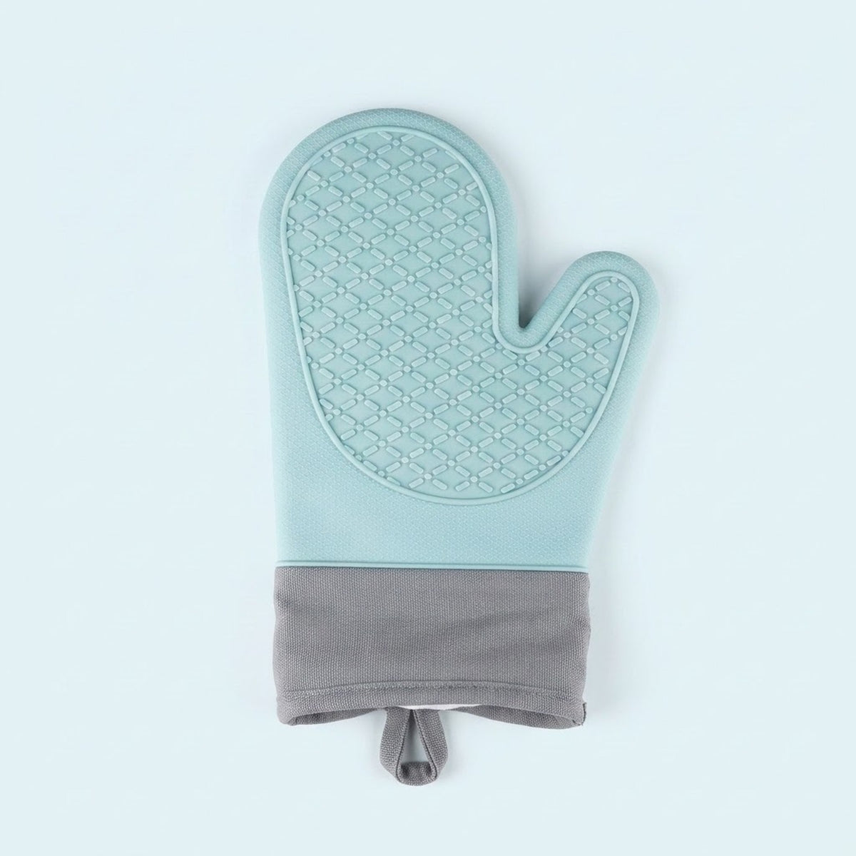 A single quilted oven mitt in a light mint green color with a textured diamond pattern on the palm side and a solid gray fabric cuff at the bottom, shown against a plain light blue background.