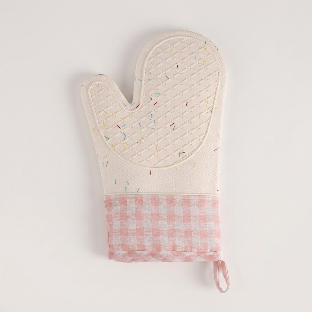 A quilted oven mitt with a white top half featuring a subtle multicolor sprinkle pattern, and a pink and white gingham checkered bottom cuff with a hanging loop, shown on a plain white background.