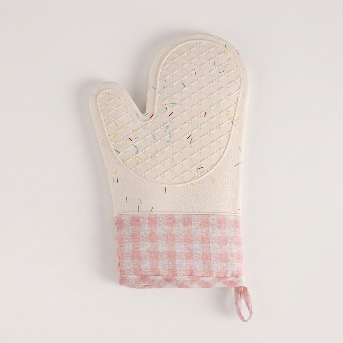 A quilted oven mitt with a white top half featuring a subtle multicolor sprinkle pattern, and a pink and white gingham checkered bottom cuff with a hanging loop, shown on a plain white background.