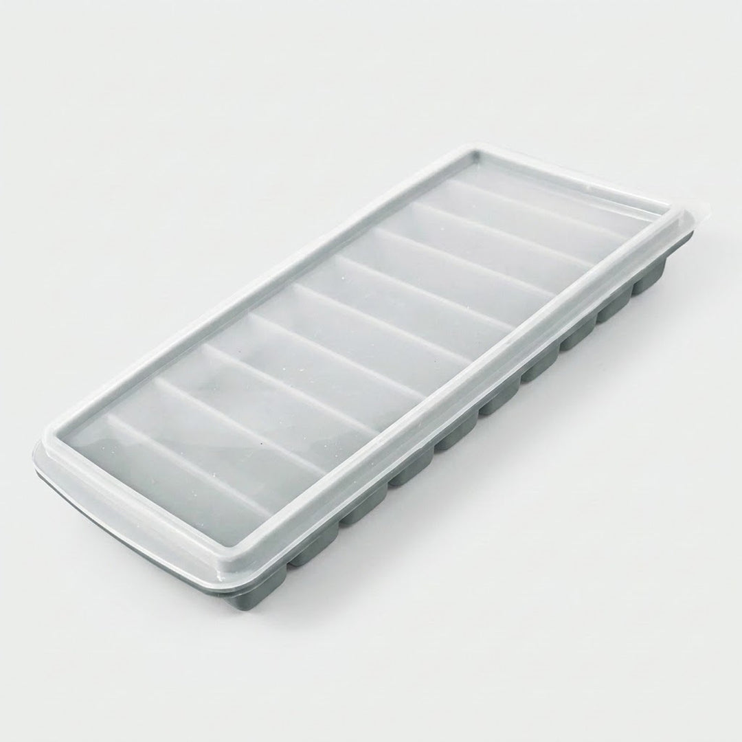 A rectangular plastic ice cube tray with a translucent frosted lid and gray base, photographed on a clean white background.