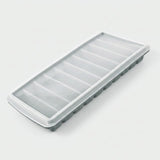 A rectangular plastic ice cube tray with a translucent frosted lid and gray base, photographed on a clean white background.