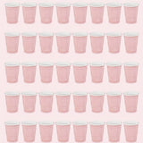 Forty pale pink cups with white rims are arranged in five rows of eight against a light pink background.