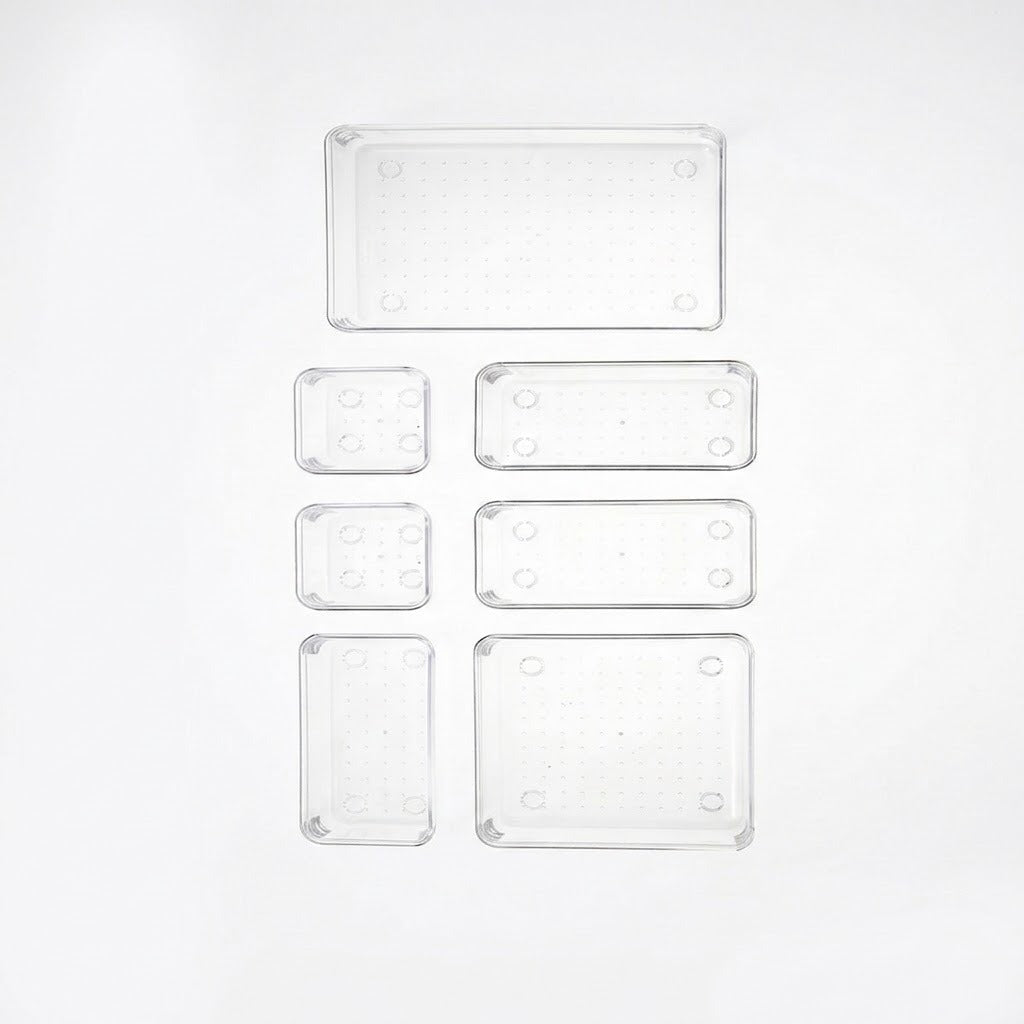 Six clear rectangular plastic trays of different sizes arranged in a grid on a white background.