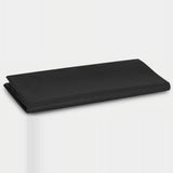 A folded black fabric item, likely a tablecloth or sheet, displayed on a clean white studio background.