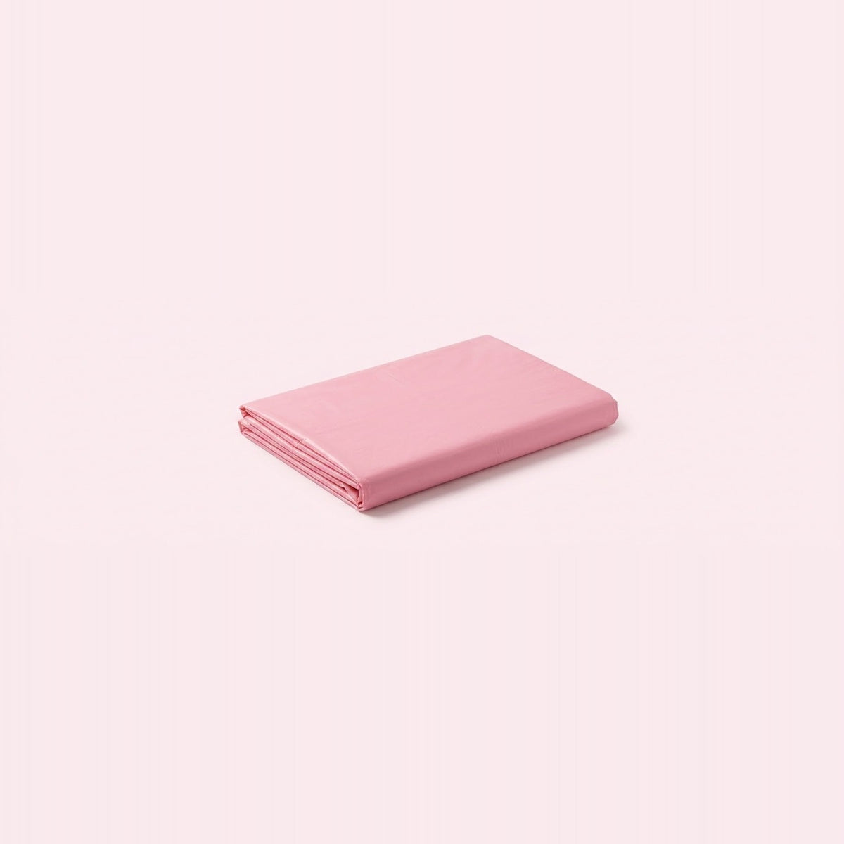 A folded pink sheet or fabric item shown on a plain pale pink background.