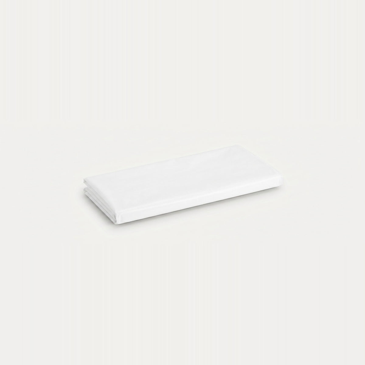A folded white fabric item, likely a sheet or napkin, shown on a plain off-white background.