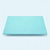 A square, light turquoise textured panel or mat shown from a top-down perspective on a clean, light gray background.