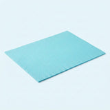 A square light blue textured mat with a fine grid pattern, shown at an angle on a clean white background.