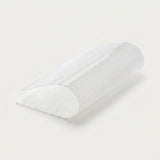 A white textured semi-transparent arch support pillow, shown partially rolled on a clean off-white background.