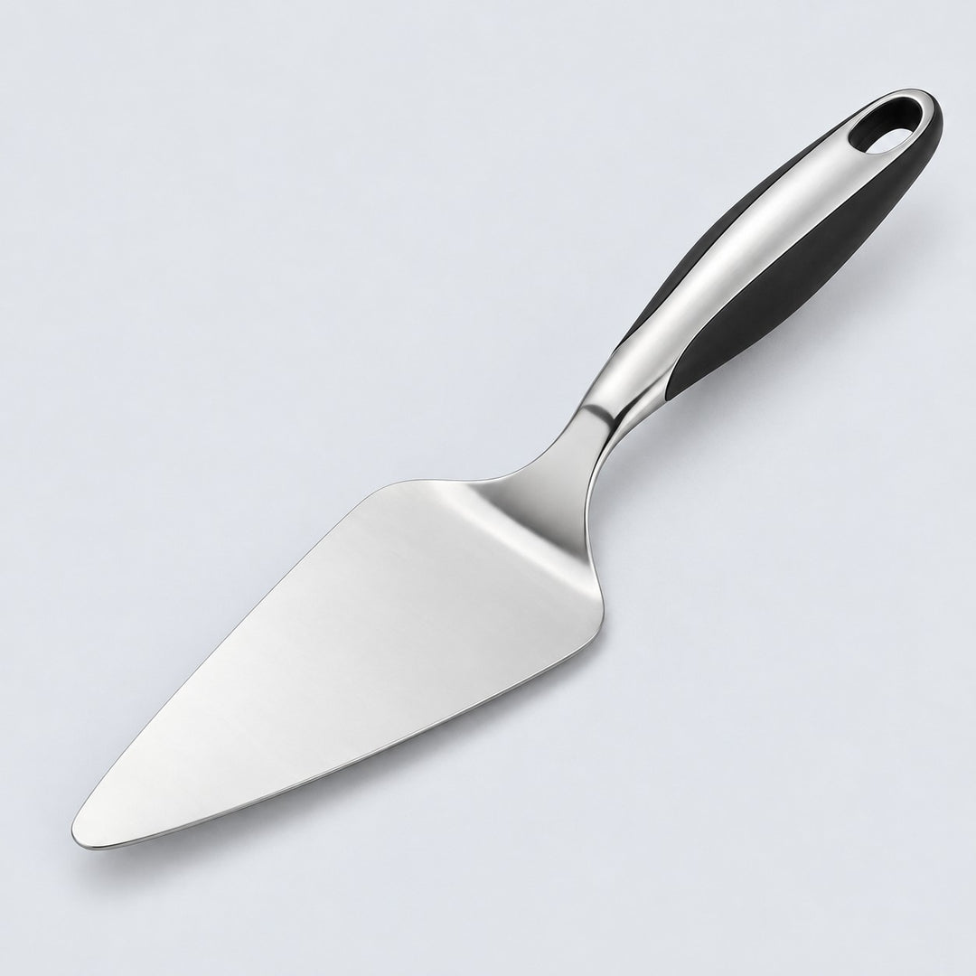 Stainless steel pizza server with triangular blade and black handle on a pale studio background.