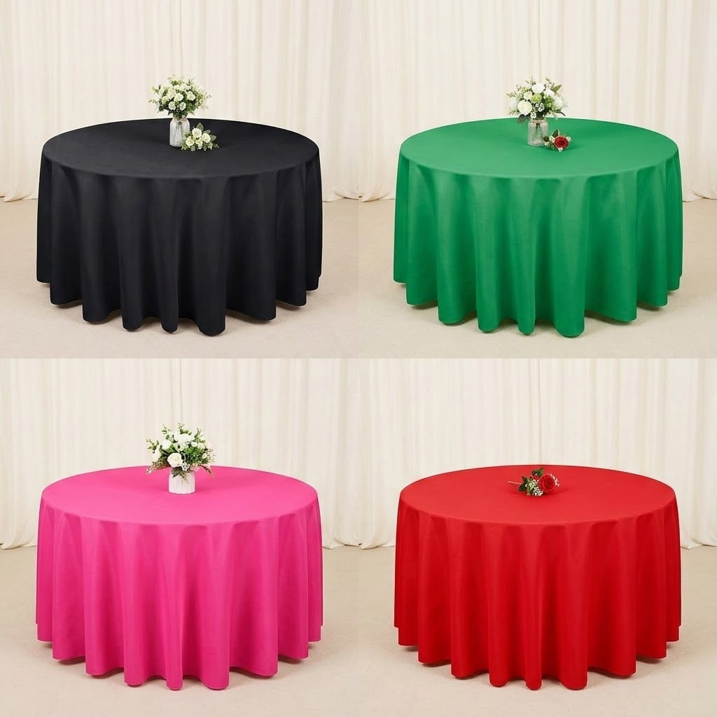 Four round tablecloths shown in a 2x2 grid: black, green, pink, and red. Each table is covered with a draped tablecloth and styled with a small floral arrangement on a light neutral floor and drape backdrop.