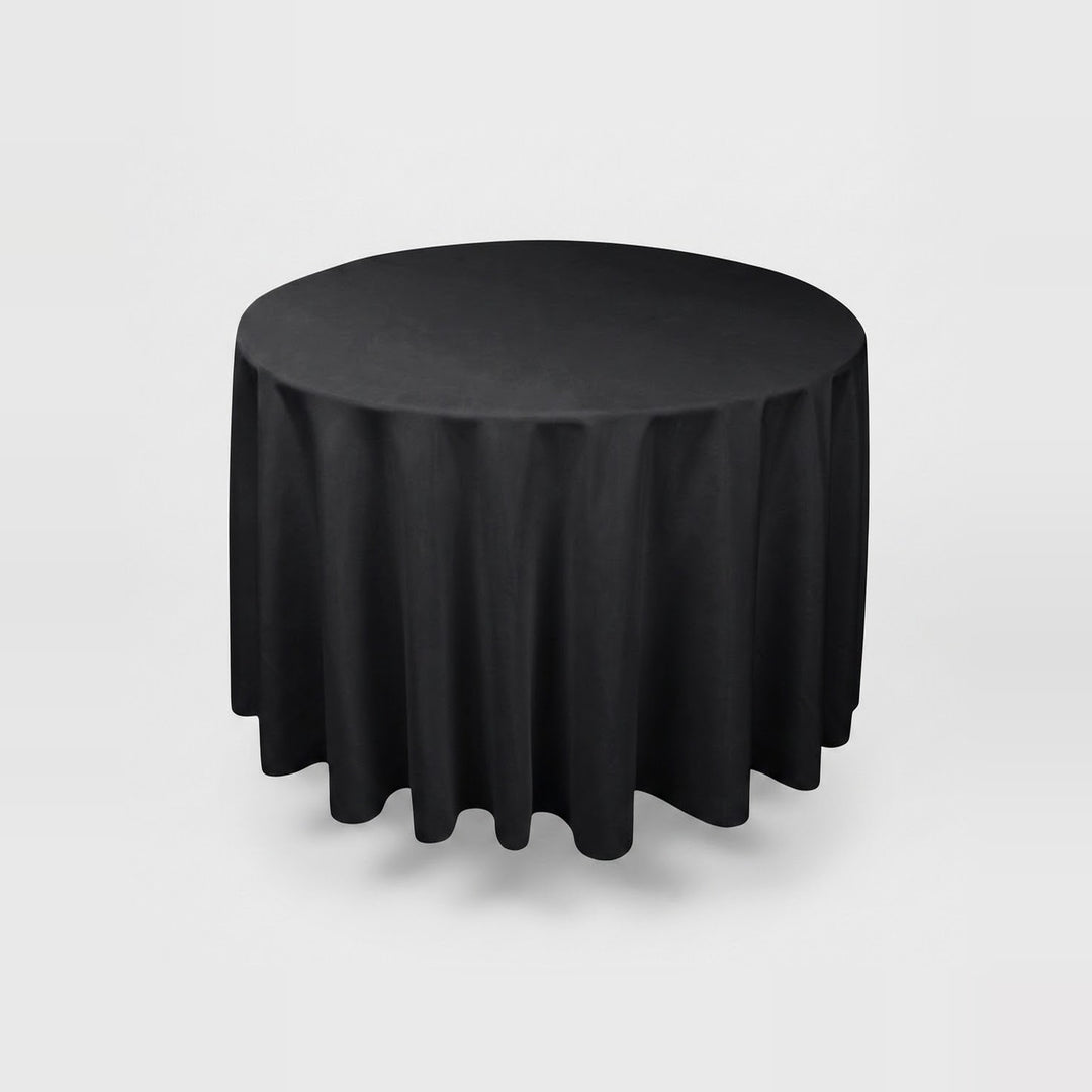 A round black tablecloth draped over a round table, shown against a light gray studio background.