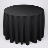 A round black tablecloth draped over a circular table, shown against a plain light gray studio background.