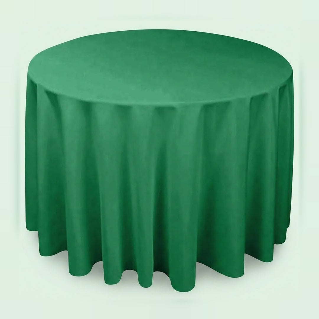 A round green tablecloth draped over a round table, shown against a plain light background.