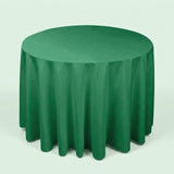 A round green tablecloth draped over a round table, shown against a plain light background.