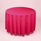 A bright pink round tablecloth draped over a circular table, shown against a solid pale pink background.