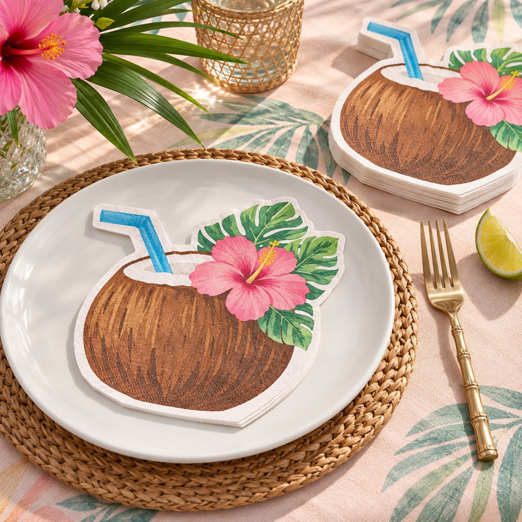 A Coconut Drink Hawaiian shaped paper napkin accents a tropical place setting on a dinner plate.