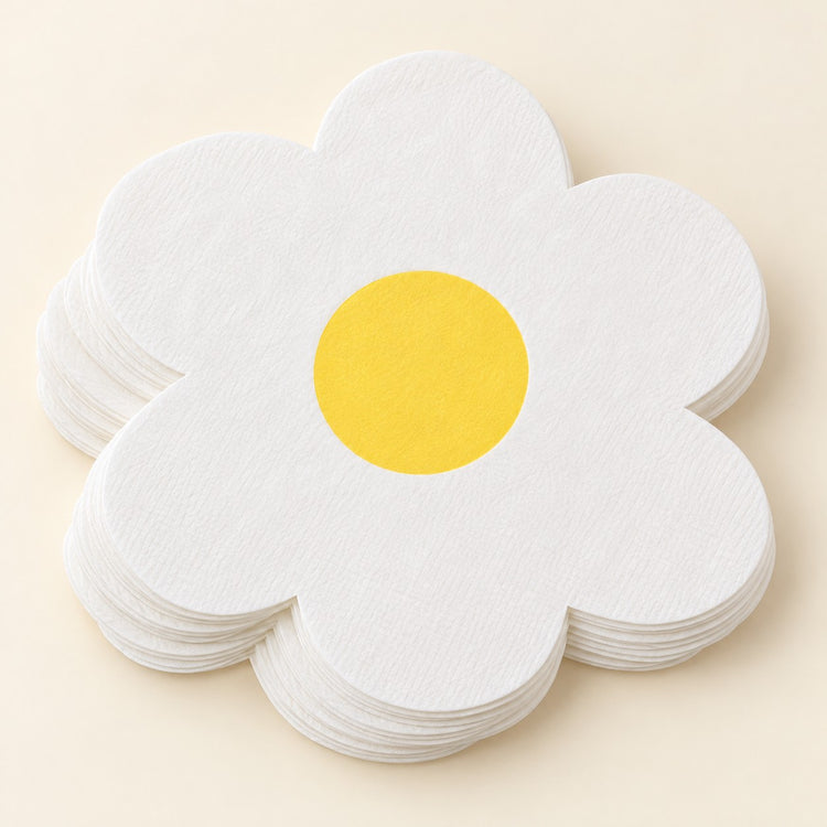 White Daisy Hawaiian shaped paper napkins are stacked on a soft cream studio background.