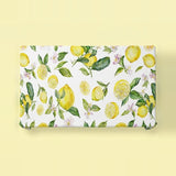 A rectangular gift wrap or fabric panel featuring a watercolor lemon and leaf pattern on a white background, displayed flat against a pale yellow backdrop.