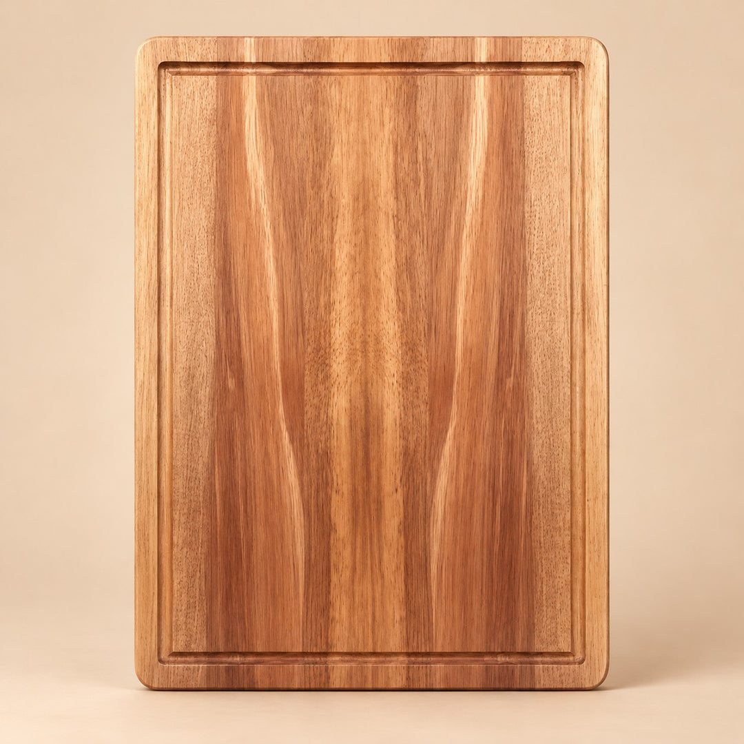 Medium Wooden Kitchen Cutting Board shown alone on a pale warm studio backdrop.