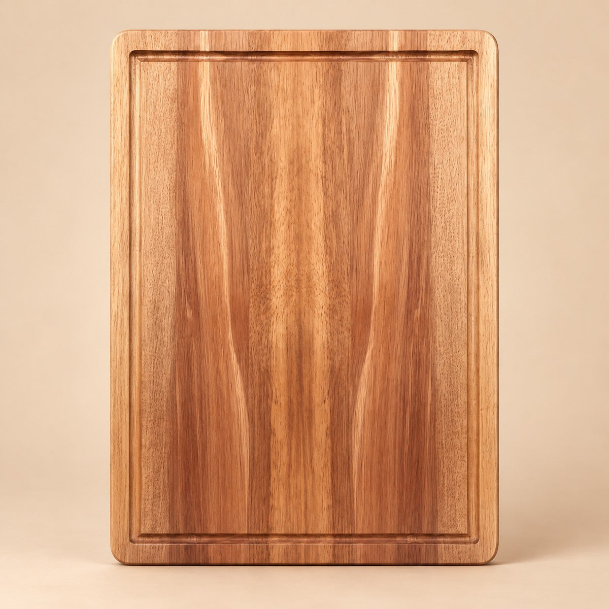 Medium Wooden Kitchen Cutting Board shown alone on a pale warm studio backdrop.