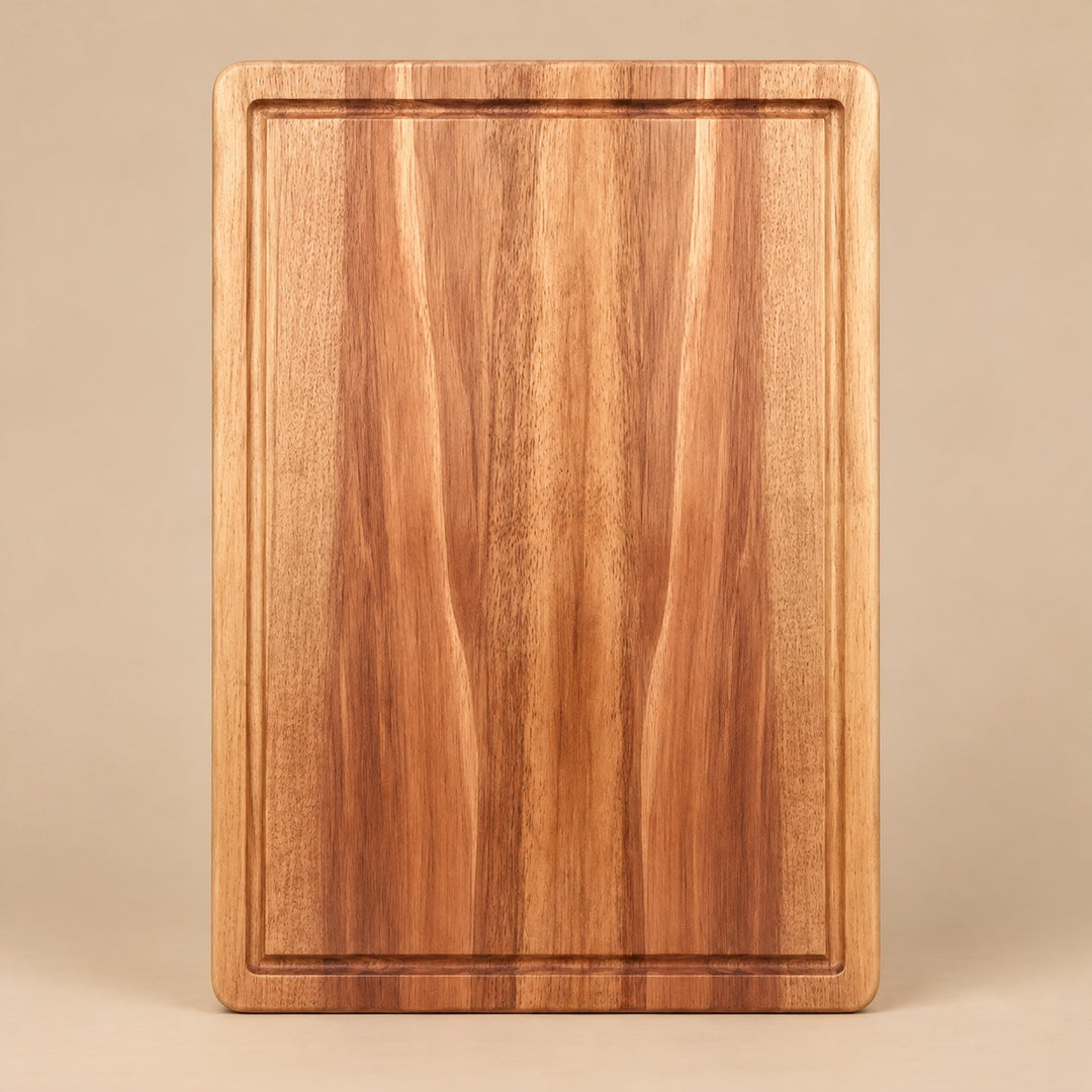 Large Wooden Kitchen Cutting Board shown alone on a pale warm studio backdrop.
