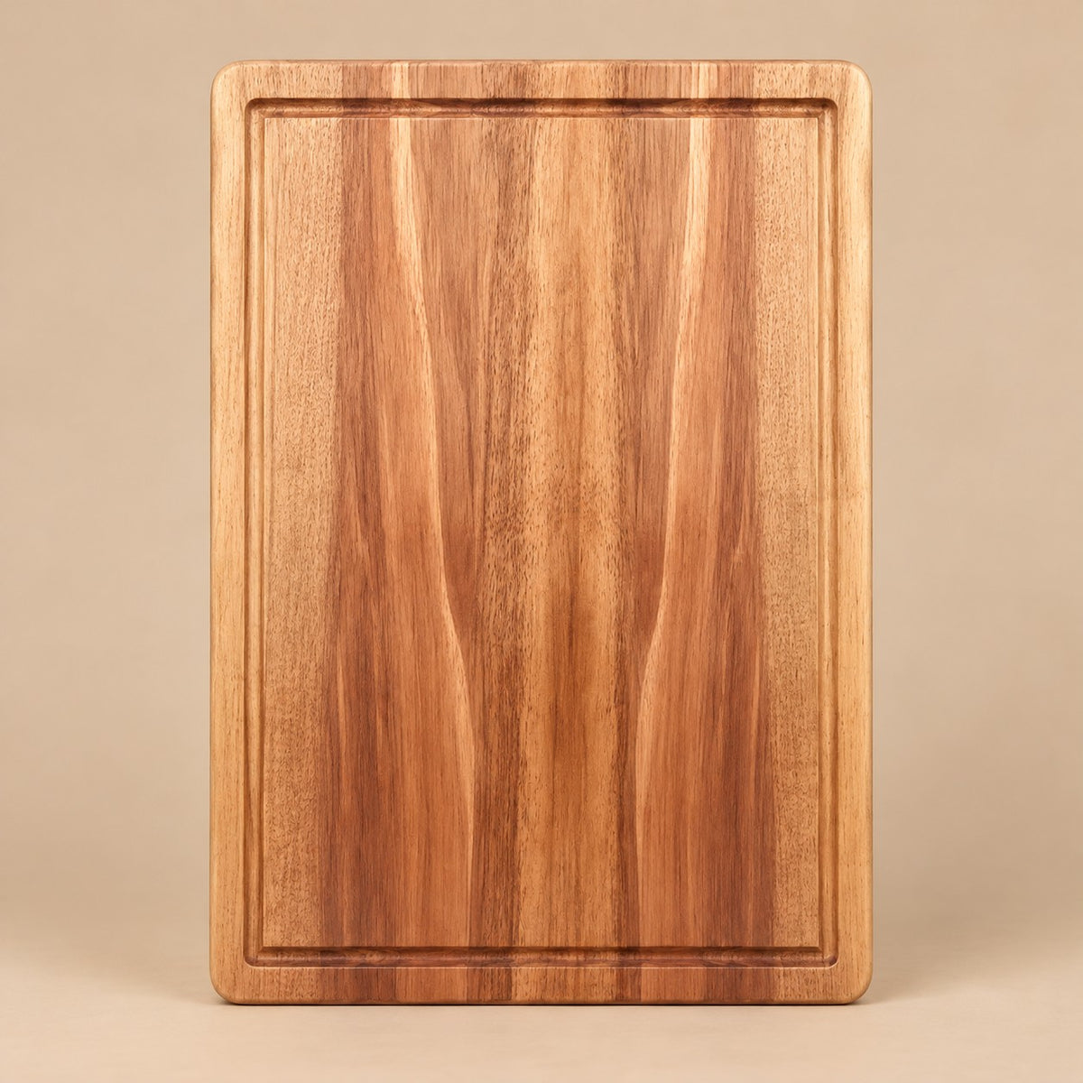 Large Wooden Kitchen Cutting Board shown alone on a pale warm studio backdrop.