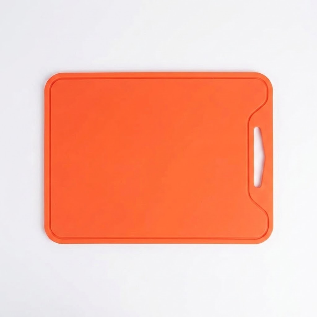 An orange rectangular cutting board with rounded corners and a handle cutout on the right side, shown from a top-down view on a white background.