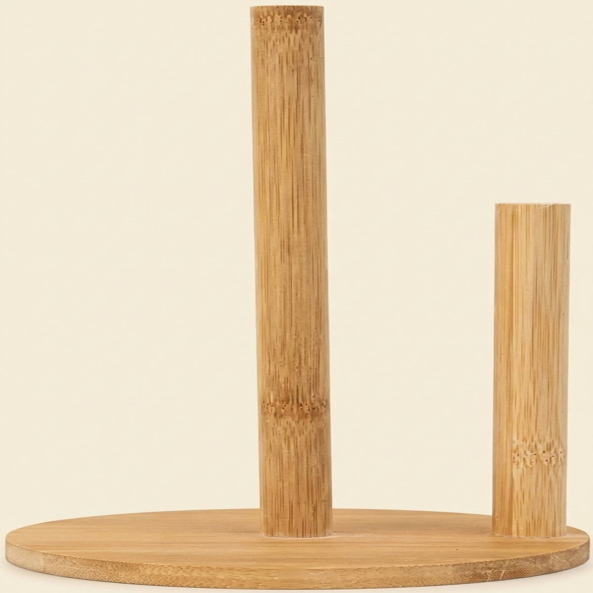 A natural bamboo tabletop organizer with a round base, featuring one tall cylindrical stand and one shorter cylindrical stand, shown against a solid light beige background.