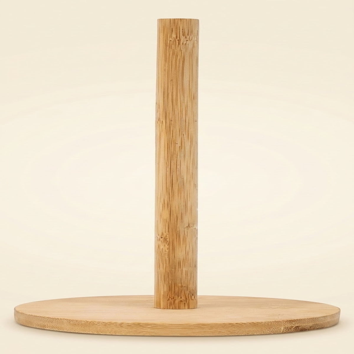 A minimalist bamboo pole stand with a round wooden base, photographed against a clean, solid cream background.
