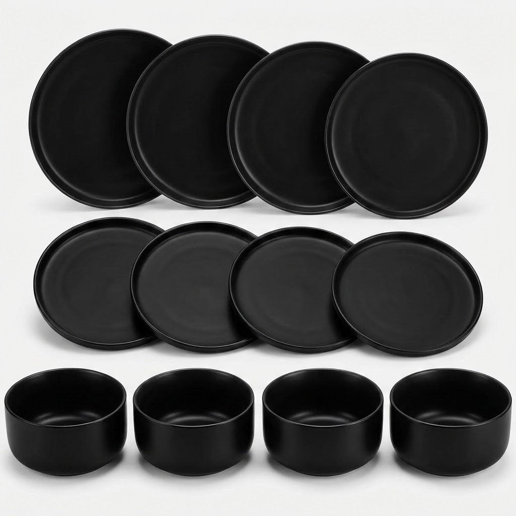 A set of matte black ceramic tableware, including six round plates and four matching bowls, arranged neatly on a clean white background.