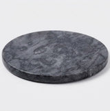 A round dark gray stone coaster with a natural marbled texture, photographed on a clean white background.