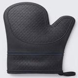 A black oven mitt with a textured honeycomb pattern, featuring a dark elastic band and a small wrist strap, shown on a light gray background.