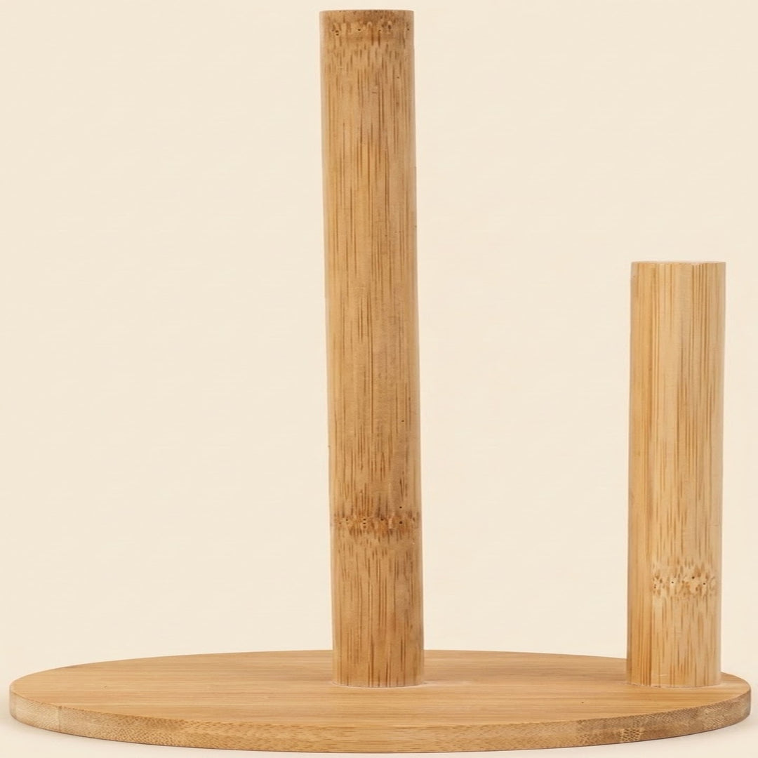 A natural bamboo tabletop accessory set featuring a round base with two vertical cylindrical supports, one tall and one short, on a solid cream background.
