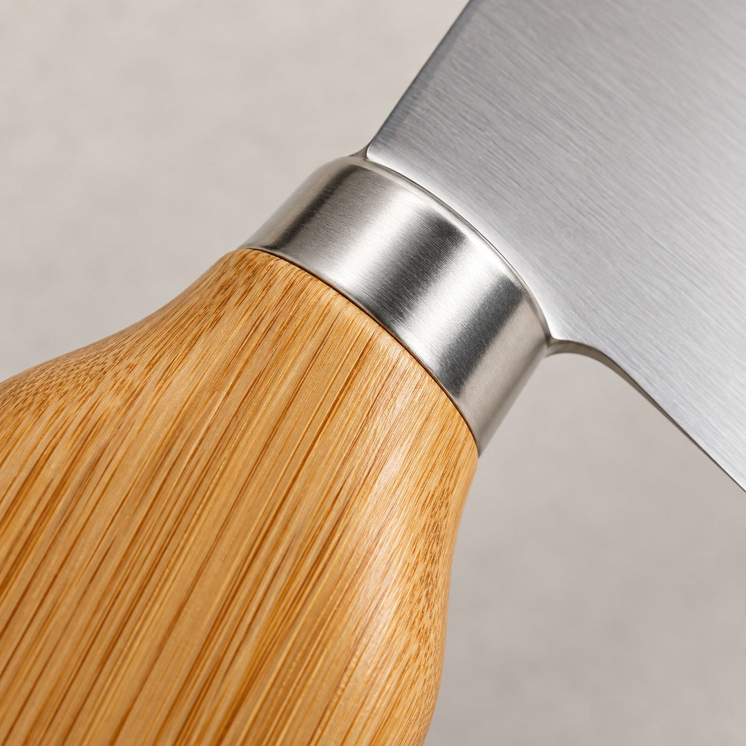A close-up shows the bamboo grain, smooth silver collar, and stainless steel blade of the cheese knife set.
