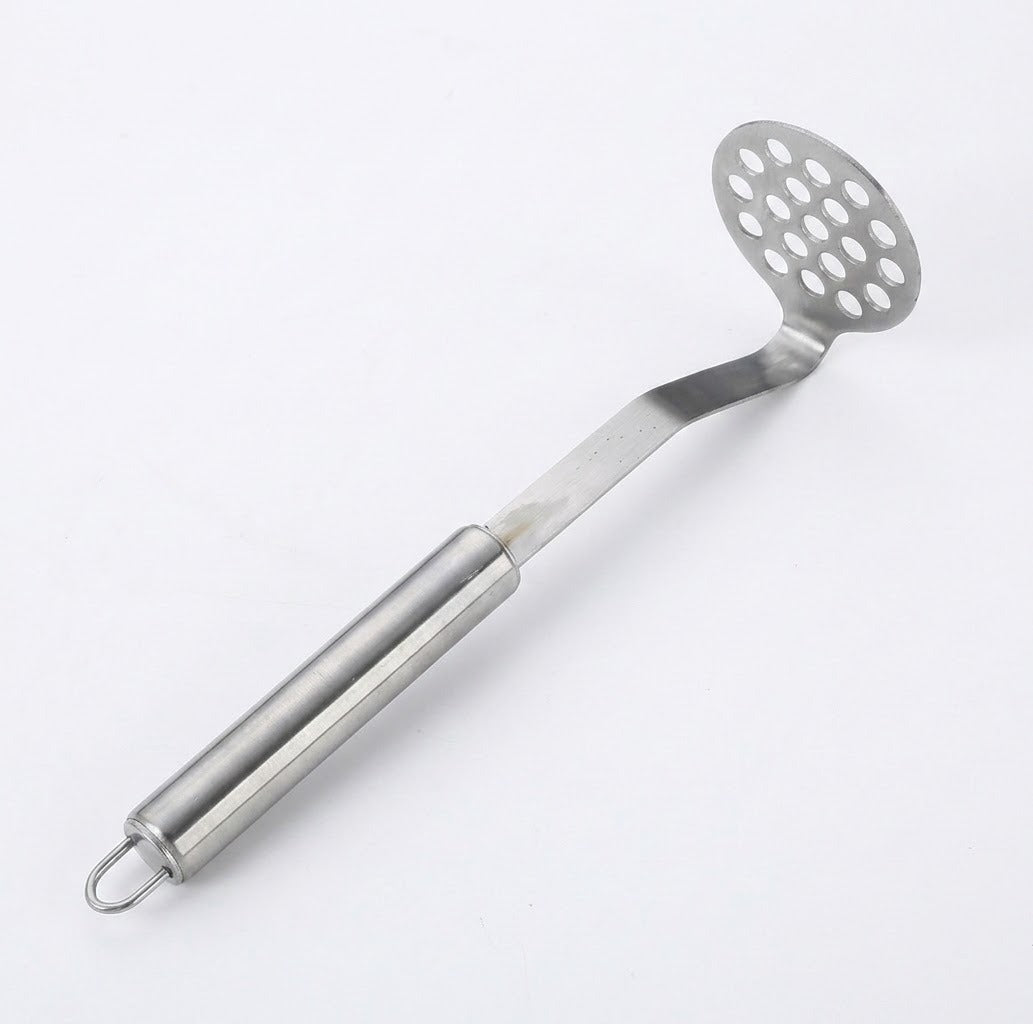 A stainless steel slotted potato masher with a long handle and hanging loop, shown on a plain white background.